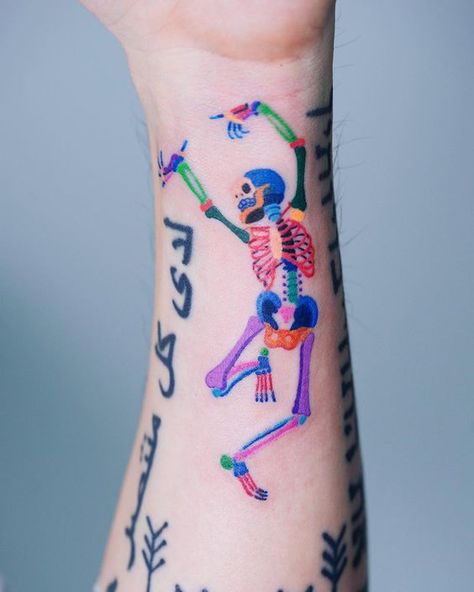 #forearmtattoos Check out our website for more tattoo ideas 👉 positivefox.com Rainbow Skeleton Tattoo, Colorful Skeleton Tattoo, Skeleton Tattoo, Skeleton Tattoos, Muster Tattoos, Disney Tattoo, Tatuaje A Color, Weird Tattoos, E Tattoo