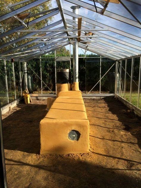 Rocket stove greenhouse - heating with wood in a more energy efficient manner. Greenhouse Farming, Rocket Stove, Plants Growing, Small Greenhouse, Greenhouse Plans, Aquaponics System, Rocket Stoves, Diy Greenhouse, Garden Greenhouse