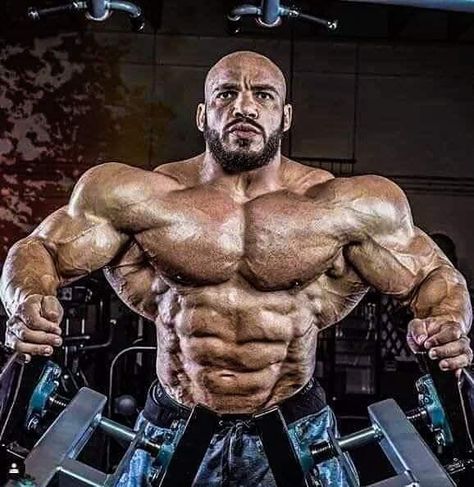 Image may contain: 1 person Big Muscular Men, Big Ramy, Bodybuilding Posing, Male Figure Reference, Poses Gym, Muscle Reference, Bodybuilding Pictures, Bodybuilding Tips, Muscular Male