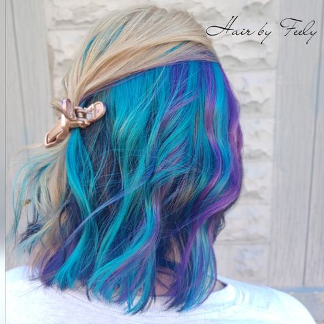 Blue hair, purple hair, blonde hair, galaxy hair, short hair, curls, peek a boo, under color, goldwell, elumen, #hairbyfeely #letmefeelyyourhair Blond Hair With Blue Peekaboos, Hidden Vibrant Hair Color, Purple Under Blonde Hair, Blue Underneath Hair Blonde, Purple Hair Blonde, Pink Purple Blue Hair, Short Hair Curls, Under Hair Dye, Purple And Green Hair