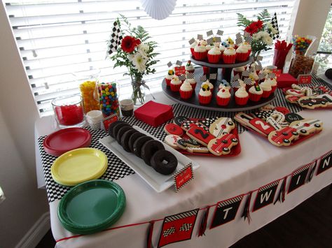 nascar twins baby shower party décor - dessert bar cupcakes cookies candy stoplight plates and donuts called spare tires Race Car Birthday Party Ideas Cake Dessert Tables, Two Fast Sweet Table, Race Car Themed Cupcakes, Race Car Theme Dessert Table, Fast One Dessert Table, Two Fast Dessert Table, Fast One Cupcakes, Race Car Cupcakes Ideas, Cars Dessert Table