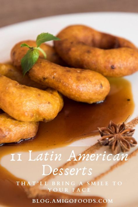 Picarones are a Peruvian food, strikingly similar to Spanish buñuelos, but they’re in a league of their own when it comes to flavor. These deep-fried delicacies are a stroke of genius from the Peruvians and deservedly made our list of the best Peruvian desserts. #latinfood #dessert #peruvianfood #picarones #amigofoods Costa Rican Desserts, Spanish Dessert Recipes, Peruvian Desserts, Coconut Flan, Spanish Desserts, Latin American Food, Peruvian Food, A League Of Their Own, League Of Their Own