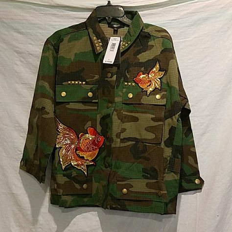 Fair Child Camo Jacket With Patches. Stud Details On The Collar And Pockets. Sequined Fish Patches On The Front And On The Back. Jacket Is About 25 Inches Long From Shoulder Down. There Are Two Big Functional Pockets At The Top Front And Two Decorative Pockets At The Bottom. 51% Rayon, 49% Polyester. Camo Jacket With Patches, Jacket With Patches, Camouflage Fashion, Camouflage Jacket, Diy Fashion Clothing, Army Fashion, Army Jacket, Camo Jacket, Men's Wear