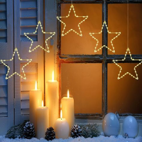 Classic and versatile, string lights can be draped around trees, roofs, and inside the home. Look for warm white or colorful options. Christmas Star Lights Outdoor, Hanging Star Lights, Hanging Star Light, Christmas Window Decoration, Star Christmas Lights, Star Lights, Window Decorations, Christmas Window Decorations, Unique Christmas Decorations