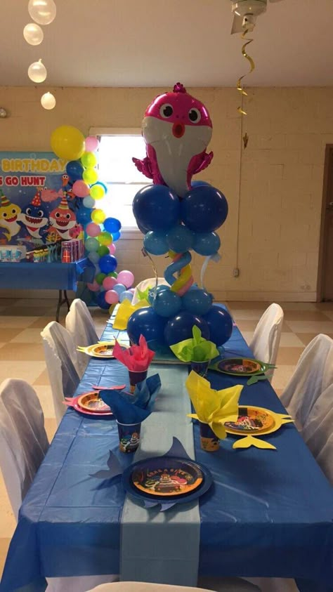 Baby shark table Baby Shark Table Decorations, Baby Shark Centerpiece Ideas, Baby Shark Table, Cumpleaños Baby Shark, Baby Shark Birthday Party, Shark Themed Birthday, Mommy Shark, Shark Themed Birthday Party, Baby Shark Birthday