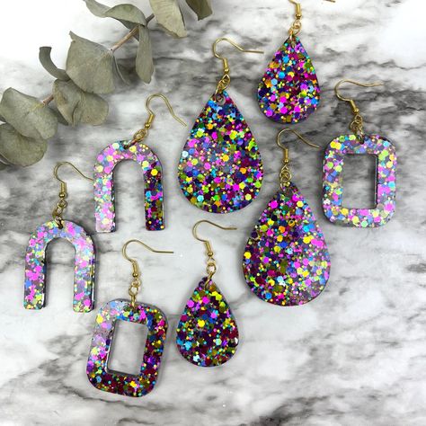 Sparkly Dangle Earrings. Choice Of Large Or Small Teardrop, Rounded Rectangle, Or Arch Hand Poured Resin. Lightweight. Gold Plated Ear Wires. Large Teardrop - Approximately 2" X 1.5" Small Teardrop - Approximately 1.5" X 1" Rounded Rectangle - Approximately 1.25" X 1.5" Arch - Approximately 1.25" X 1.5" Fishhook Ear Wires Add Approximately 1" To Total Length. Diy Resin Projects, Rounded Rectangle, Teardrop Dangle Earrings, Glitter Hair, Resin Diy, Silver Glitter, Resin Jewelry, Ear Wires, Hand Poured