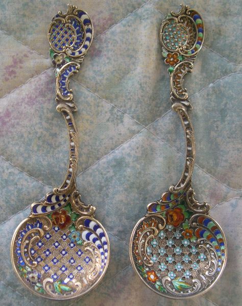 These spoons use sterling silver as the base metal and use sterling silver wire to create the  cloisonne design. They have also been gold plated. Both of these spoons were produced by the short lived New York silversmithing firm of Bachrach & Freedman (1895-1900) Art Nuevo, Kitchen Window Design, Bridal Cuff, Spoon Collection, Vintage Silverware, Cutlery Sets, Silver Spoons, Silver Enamel, Antique Shops