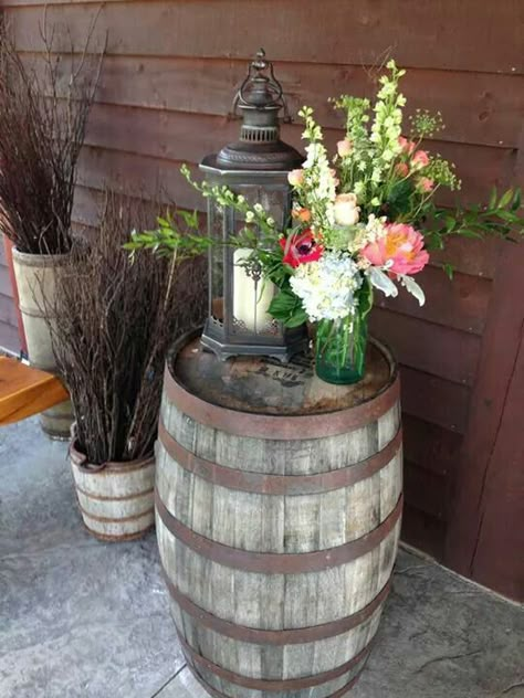 Entrance centerpiece atop a whiskey barrel with a lantern. Our in-house floral designer has a great talent for using beautiful arrangements with other decor to create any Style or look the Client wishes. Whiskey Barrel Decor, Barrel Decor, Country Porch, Diy Outdoor Decor, Entrance Porch, House With Porch, Front Porch Decorating, Whiskey Barrel, Wine Barrel