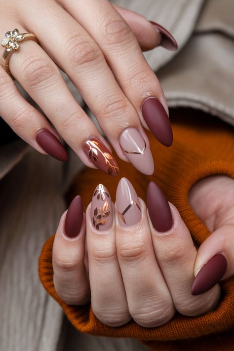 Get ready to flaunt your creativity with these stunning dip nails that embody the essence of fall. Picture rich burgundy and deep forest green, elegantly layered to capture the beauty of autumn leaves. Add a touch of gold shimmer for a chic twist that will turn heads wherever you go. These fall nail ideas are perfect for any occasion, celebrating the season in style. Embrace the trend and let your nails do the talking! #FallNailIdeas #DipNails #AutumnNails Fall Nails Ideas Autumn Burgundy, Cranberry And Gold Nails, Burgundy With Gold Nails, Fall Season Nails Almond, Nails With Leaves Fall, Green And Copper Nails, Autumn Dip Nails, Fall Nail Designs Red, Fall Dip Nails Ideas