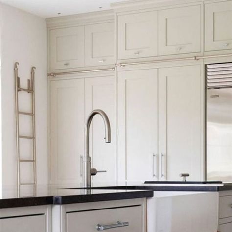 Having been approached by a designer we have worked with in the past, we created this bespoke ladder solution in a brushed nickel finish to complement this Shaker-style kitchen.

#andrewnebbettdesigns #bespoke #bespokedesign #interiors #interiordesign #interiordesigner #madetomeasureladders #libraryladders #brushednickel #metalfinishes #madeintheuk Kitchen With Ladder Rail, Kitchen Ladder Ideas, Kitchen With Ladder, Ladder In Kitchen, Bright Modern Kitchen, Library Ladders, Kitchen Ladder, Brushed Nickel Kitchen, Library Ladder