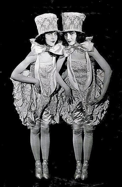 Vintage ca. late 1910′s / early 1920′s photograph of Ziegfeld Follies showgirls the Fairbanks Twins, Madeline and Marion, in a spirited jazz age costume view. Though not actually twins, the sisters were a fixture in vaudeville, early silent film, and become featured stars in the Ziegfeld Follies and Midnight Frolic revues. (by Culver Pictures Inc., NY) / src: Grapefruit Moon Gallery Busby Berkeley, Ziegfeld Girls, Ziegfeld Follies, Flower Costume, Burlesque Costumes, The Sisters, Jazz Age, Old Hollywood Glamour, Silent Film