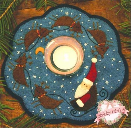 Santa & Reindeer Candle Mat Kit: This darling candle mat features Santa and his reindeer encircling a starry sky.  Kit includes pattern, wool felt, embroidery floss, and beads.  Mat finishes to approximately 9" in diameter. Candle Mats Patterns, Wool Candle Mats, Felt Candle Mats, Reindeer Applique, Penny Rug Patterns, Candle Mats, Wool Felt Projects, Wool Applique Patterns, Felted Wool Crafts