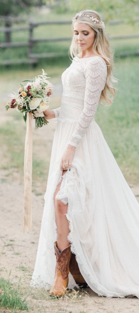 #ad Country Rustic Wedding Dress by Maggie Sottero Designs -Deirdre. Modest lace long sleeves a-line skirt and cowboy boots. Bateau neckline, V-back #maggiesottero #mylovestory #maggiebride KristinaCurtis Photography, KristenPackardArtistry, QuietMeadowFarm, BridalCloset, FlourandFlourish, DiamondRentalEvents, OverTheTopEvents #weddingdress #weddingdresses #bridalgown #bridalgowns #weddinggown #dreamdress #bridalcollection #bridaldress #dress Click to see more wedding dresses Lace Wedding Dress Country, Wedding Dress Mermaid Lace, Country Wedding Dress, Modest Lace Wedding Dresses, Boho Wedding Dress With Sleeves, Fitted Lace Wedding Dress, Rustic Wedding Dress, Simple Lace Wedding Dress, Strapless Lace Wedding Dress