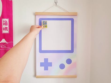 Purple Gameboy pin banner is a fun and stylish way to display your love of gaming. Perfect for gamers of all ages, this banner is made of high-quality pins and features a vibrant purple Gameboy design. Hang it on your wall, mantle, or anywhere else you want to show off your gaming pride! #gameconsole #gamer #gaming #gameroom . #Geeky_Living_Room #Patch_Display #Monster_Snacks #Banner_Game Patch Display, Monster Snacks, Banner Game, Pin Banner, Mini Homes, Patches Display, Pins Badge Display, Purple Games, Enamel Pin Display