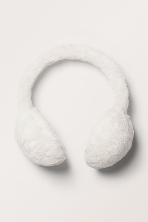 A pair of fuzzy earmuffs crafted from a plush recycled polyester. Fuzzy Headphones, Christmas Wishlist Items, Christmas Gift Wishlist, Cute Wishlist, White Earmuffs, Cute Earmuffs, Fuzzy Earmuffs, Realistic Wishlist, Xmas List Ideas