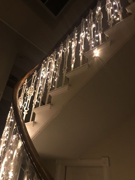 Beautiful fairy lights along the spindles of a Victorian guesthouse in Scotland. Really effective for lighting up the hallway Fairy Lights On Stairs, Fairy Lights Stairs, Stair Banister, Fairy Lights Decor, Circular Stairs, Fairy Home, Stair Lighting, Light Beam, Pretty Lights