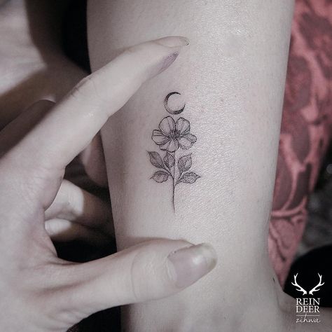 Moon Tattoos: Single Flower Crescent Moon. A simple flower and tiny crescent moon with faded shading and crisp lines. Click through for 53 moon tattoo ideas. #moontattoo #tattoos #tattooideas #flowertattoo IG: @zihwa_tattooer Empowerment Tattoo, Empowering Tattoos, Medusa Tattoo Design, Moon Tattoos, Hand And Finger Tattoos, Crescent Moon Tattoo, New Tattoo Designs, Wild Tattoo, Best Tattoos For Women