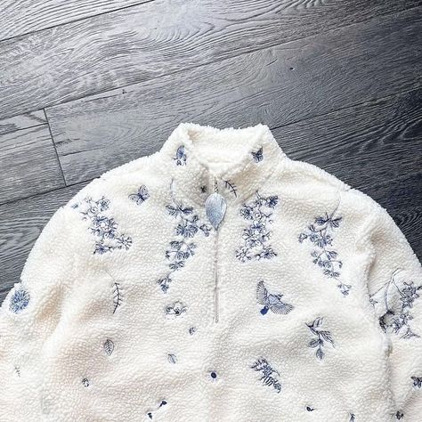 YITAI on Instagram: "I've always wanted to pay homage to my Chinese roots through design, and I was particularly inspired by the blue hues of Fine China Ceramics. This sherpa jacket has delicate embroidery featuring graceful bird motifs and the serene descent of flower blooms, evoking the peaceful imagery of drifting petals. It’s then complemented with a metallic leaf zipper. It took months and four rounds of sampling to perfect." China Ceramics, Tea Clothes, Men Embroidery, Embroidery Men, Male Outfits, Delicate Embroidery, Clothing Pieces, Bird Motif, Embroidery Motifs