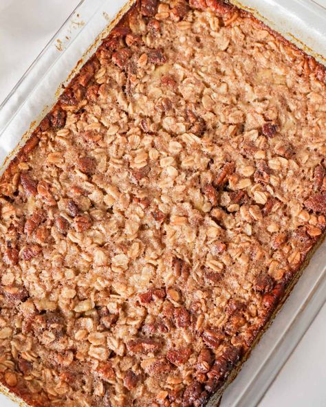 Baked Banana Nut Oatmeal in a baking dish Banana Nut Oatmeal Bake, Banana Nut Baked Oatmeal, Baked Oatmeal Casserole, Banana Nut Oatmeal, Banana Baked Oatmeal, Protein Baking, Pecan Rolls, Baked Oatmeal Recipes, Breakfast Meal