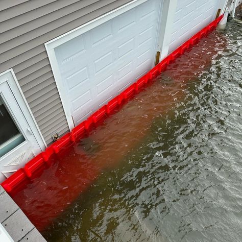 Water Diversion Barriers | Garrison Flood Control — Garrison Flood Control Water Barrier Around House, How To Stop Water From Coming In House, Flooding Yard Solutions, Flood Prevention Ideas, Flood Barrier Diy, Flooding Preparedness, Backyard Flooding Solutions, Flood Proof House Design, Home Flood Prevention