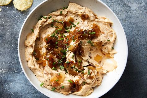 For the creamiest, dreamiest vegan onion dip, use a high-speed blender, if you have one There is some down time in this recipe — soaking the cashews and letting the dip rest — but don’t be tempted to skip those steps The cashews need to soak so they blend as smoothly as possible, and the finished dip benefits greatly from some time to let the flavors come together Best Superbowl Food, Best Dip Recipes, Onion Dip Recipe, Onion Dip, Nyt Cooking, Vegan Thanksgiving, Thanksgiving Appetizers, Super Bowl Food, Dip Recipes