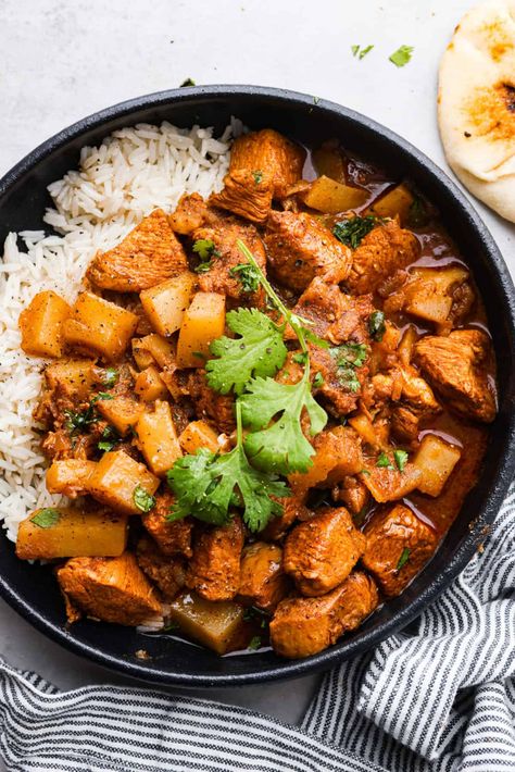 If you’ve never had Chicken Vindaloo, you’re in for a treat! This classic Indian dish is made with chunks of marinated chicken and tender potatoes simmered in a tangy, flavorful, and perfectly spiced broth. Serve over fluffy white rice with Perfect Naan Bread for an irresistible, comforting meal! Instant Pot instructions included! Chicken And Potato Recipes, Chicken Vindaloo Recipe, Vindaloo Recipe, Chicken Vindaloo, The Recipe Critic, Recipe Critic, Vindaloo, Chicken Chili Recipe, Butter Chicken Recipe