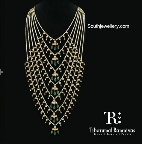 Satlada haar adorned with pearls, polkis and emeralds by Tibarumal Ramnivas Jewellers. Fine Diamond Jewellery Satlada Necklace Gold, Bridal Haaram, Satlada Necklace, Jewellery South Indian, Emerald Jewellery, Gold Jewelry Simple Necklace, Pearl Necklace Designs, Long Pearl Necklaces, Fine Gold Jewelry