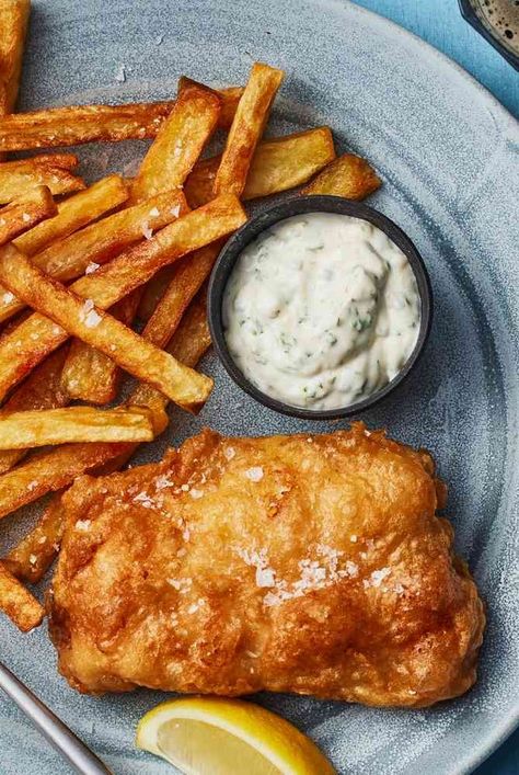 Make classic British fish and chips at home with this recipe, which includes fried cod, tartare sauce, triple-fried french chips, and mushy peas. Homemade Fish And Chips, British Fish And Chips, Pub Night, Fish Batter Recipe, Fish N Chips Recipe, Fried Cod, Fried Fish Recipes, Night At Home, Baked Fish