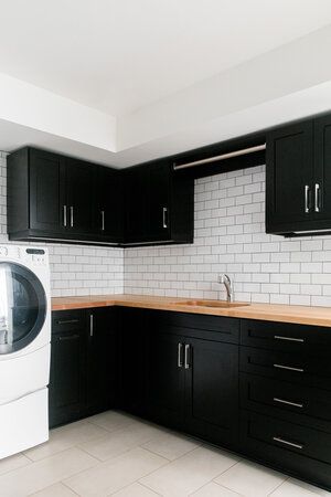 Grey Walls With Black Cabinets, Black Cabinet With Butcher Block, Black Cabinets Butcher Block Countertops, Butcher Block Black Cabinets, Butcher Block Counter Black Cabinets, Black Cabinets With Butcher Block Top, Small Black Kitchen Cabinets, Laundry Room Ideas Black Cabinets, Black And White Kitchen Cabinets Butcher Block