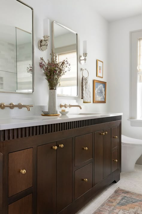 Twin Cities bathroom renovation with dark oak custom beveled vanity and mixed metals. White Vanity With Dark Floor, Dark Wood Stain Bathroom Vanity, Dark Stain Bathroom Vanity, Alder Wood Cabinets, Jkath Design, Master Vanity, Dark Wood Bathroom, Custom Bathroom Vanity, Newly Remodeled Kitchens