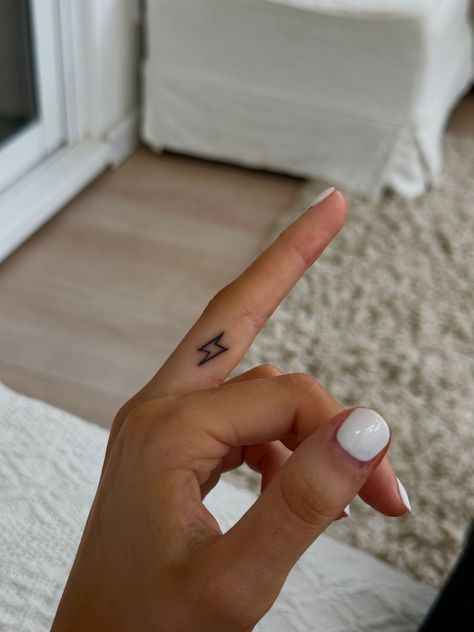 #tattoo #fingertattoo Lightning Bolt Finger Tattoo, Lighting Bolt Finger Tattoo, Lighting Bolt Hand Tattoo, Small Lightening Bolt Tattoos, Tiny Tattoo Lightning Bolt, Lightning Bolt Tattoo, Bolt Tattoo, Lightning Bolt, Finger Tattoos