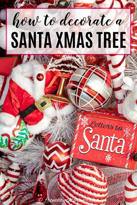 With red and white ribbon, Santa ornaments and picks and a Santa hat tree topper, this Santa Christmas tree theme is a fun and festive way to decorate for Christmas. Santa Clause Tree Theme, Red And White Santa Christmas Tree, Diy Santa Tree Topper, Santa Inspired Christmas Tree, Santa Hat Tree Topper Ideas, Santa Themed Christmas Tree Ideas, Santa Clause Christmas Tree Ideas, Red Black And White Christmas Tree Ideas, Santa Christmas Trees