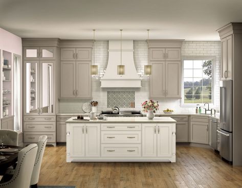 Be sure you'll love your cabinets before you place your final order. It's easy with sample doors from KraftMaid. Seeing a sample firsthand in the space it will be installed, gives you complete confidence that you're making the right decision. It also makes it easier to coordinate other design selections, like countertops, hardware, and paint. And with KraftMaid's Lifetime Limited Warranty and quality craftsmanship, you can buy with confidence. KraftMaid Deveron 14.625-in W x 14.625-in H Moonshin Staggered Height Kitchen Cabinets, Small Kitchen Remodel Cabinets, Moonshine Kraftmaid, Natural Cream Kitchen Cabinets, Kraftmaid Cottage Cabinets, Ivory Cabinets Kitchen, Light Beige Kitchen Cabinets, Off White Kitchen Cabinets With Quartz, White Countertops White Cabinets