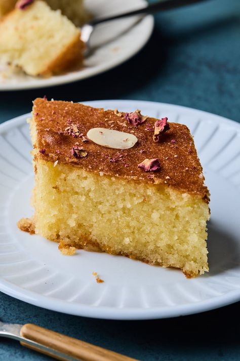 Revani as we call this sweet semolina cake in   Greek is basically a yellow sponge cake that gets steeped in a delicious   citrusy simple syrup. The sponge is fairly light with a nice crumb and   when soaked with the syrup it becomes a delight to eat. Yellow Sponge Cake, Greek Cake, Carrot Cake Loaf, Cake Loaf, Semolina Cake, Greek Sweets, Dessert Smoothie, Arabic Sweets, Cream Cheese Icing