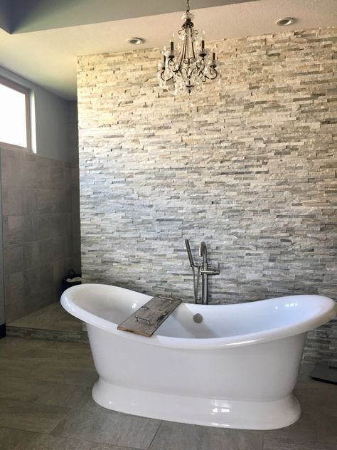 Stacked stone wall,  Free standing tub, Bath tub tray, transitional style Free Standing Tub Wall Decor, Stacked Stone Bathroom Wall, Modern Stone Bathroom, Stacked Stone Wall, Bedroom Tile, Stacked Stone Walls, Standing Tub, Tub Tray, Bathrooms Ideas