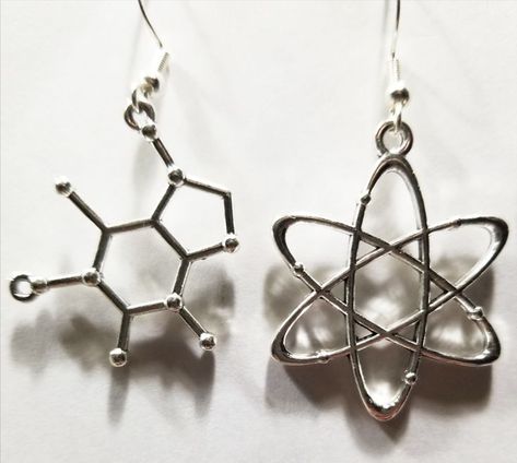 These are a pair of mismatched earrings with molecular skeletal structure charms and atomic model charms. They are on a standard ear hook. Chemistry Earrings, Atom Earrings, Chemistry Molecules, Math Earrings, Atomic Model, Skeletal Structure, Science Stem, Earring Inspo, Organic Chemistry