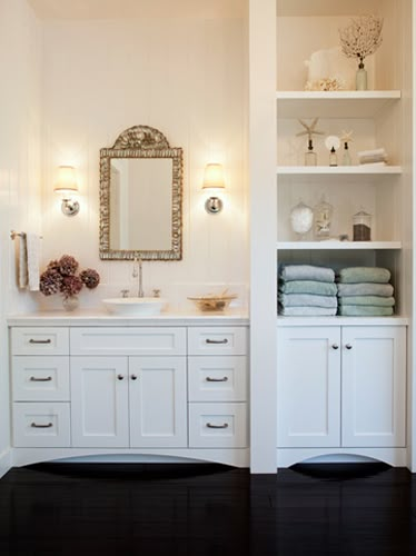 Margot Hartford Photography: chic white bathroom design with white overmount vessel sink, white bathroom cabinet vanity, Restoration Hardware Lugarno Single Sconces, mosaic tiles mirror, built-ins and glossy ebony wood floors. Bathroom Built Ins, Bathroom Linen Tower, White Bathroom Cabinets, White Bathroom Designs, Bad Inspiration, Bathroom Storage Shelves, Bathroom Closet, Linen Cabinet, Bathroom Redo