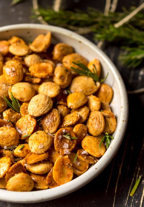 These Spiced Roasted Almonds are perfect for a salty, crunchy, healthy snack. Instead of slow roasting, these marcona almonds are toasted quickly on the stovetop then tossed with garlic powder, smoked paprika, sea salt and fresh rosemary. This 5 minute, 5 ingredient recipe is great for nighttime munchies or a snack on-the-go! Paleo, Whole30, Vegan, Gluten Free, Grain Free #paleo #whole30recipes #veganrecipes #almonds Spiced Nuts Recipe, Whole30 Vegan, Marcona Almonds, Vegan Party Food, Healthy Eating Snacks, Super Snacks, Yummy Healthy Snacks, Nut Recipes, Roasted Nuts