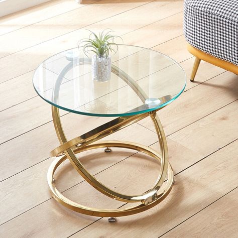 Product Details Feature: The coffee table is made of high quality 10mm tempered clear glass and chrome frame, which is durable, sturdy enough and has strong capacity. The simple combination of contemporary stainless steel and glass furniture for a modern light look,  giving you a clean feeling and matching well with the surrounding furniture. This casual round coffee table meets your everyday needs, suitable to place in the living room, bedroom and office. The anti-slip mat can prevent from burning your floor and avoid making a squealing noise. Specification: Material: Chrome, Glass Color: Clear Size: 52x52x42cm Package: 1x Side Table Delivery to the UK Highlands/Islands/Northern Ireland/Aberdeenshire are excluded from our standard delivery charge and may require extra costs.  Please note, Glass Small Table, Small Glass Coffee Table, Small Glass Table, Gold Interior Decor, Glass Center Table, Glass Table Living Room, Gold End Table, Modern Cocktail Tables, Round Glass Coffee Table