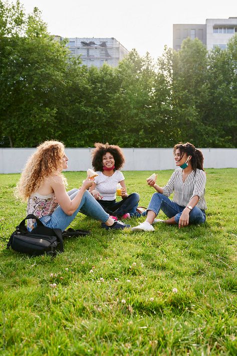 Three diverse young female friends with protective face masks around their necks talking during a picnic together in a city park People In Park Photography, Three People Sitting Together, Friend Dynamic, People In Park, Stock Photography Ideas, Friends Talking, Park Photoshoot, Architecture Design Presentation, Automotive Illustration