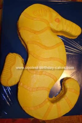 Homemade Seahorse Cake: I found a picture of a seahorse online, blew it up to 9x13 and cut it out for this seahorse cake.  I then baked a 9x13 cake.  Next I laid the picture over Seahorse Cake Birthdays, Seahorse Cake, Dolphin Party, Blue Wrapping Paper, Orange Frosting, Horse Cake, Cake Walk, Pony Party, Sweets Cake