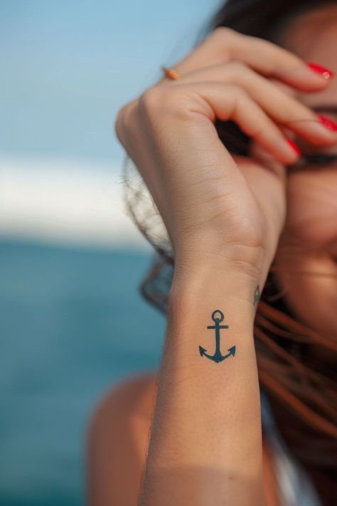 Looking for stunning wrist tattoo design ideas?! This anchor wrist tattoo is TOO gorgeous. From subtle and elegant to bold and creative, find the perfect wrist tattoo to match your style. Anchor Tattoo Placement For Women, Anchor Tatoos Woman, Hope Anchor Tattoo, Anchor Wrist Tattoo, Anchor Tattoo Designs For Women, Fineline Anchor Tattoo, Navy Anchor Tattoos For Women, Navy Mom Tattoo Ideas, Compass Anchor Tattoo Design