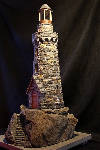 miniature stone lighthouses Light House Diy Projects, Lighthouse Diorama, Lighthouse With House, Model Lighthouse, Miniature Stone Houses, Clay Pot Lighthouse, Lighthouse Dollhouse, Lighthouse Crafts, Lighthouse Decor