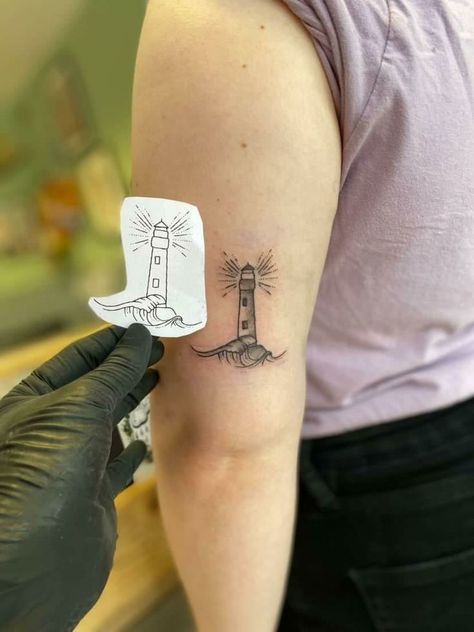 Unique & Cute Travel Tattoo Ideas For Women Lighthouse Ankle Tattoo, Simple Light House Tattoo, Dainty Lighthouse Tattoo, Fine Line Lighthouse Tattoo, Lighthouse Tattoo Stencil, Lighthouse Tattoo Simple, Simple Lighthouse Tattoo, Lighthouse Tattoo For Women, Minimalist Lighthouse Tattoo