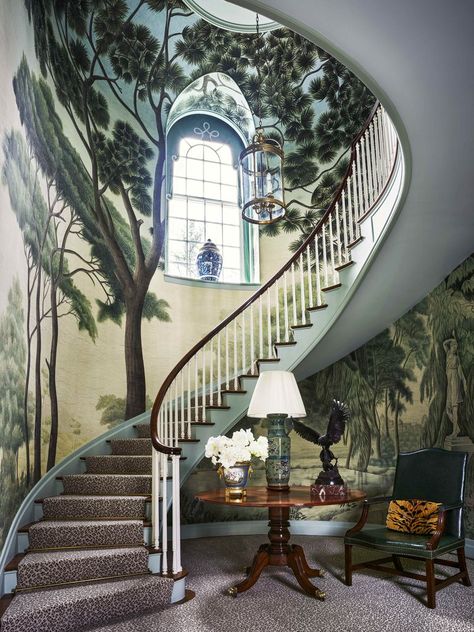 Designer Miles Redd: A mural of an Italian landscape forms a grand Arcadian canopy over the domed clockwise stairwell, wrapping it in towering greenery. Custom-printed mural, Iksel Decorative Arts. Veranda Magazine. 1920s Georgian-style house, Greenwich, CT woodland fantasia. The idyllic panorama spans the walls of the entrance hall and envelops the serpentine main staircase, the verdant canopy soaring up to the second-floor landing. Greenwich House, Veranda Magazine, Georgian Style Homes, 1920s House, Scenic Wallpaper, The Staircase, Painted Walls, Painted Wall, Country French