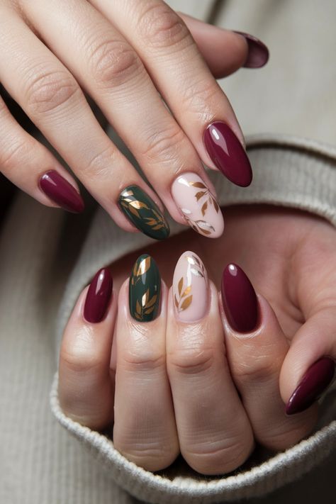 Embrace the beauty of the season with these fall nail ideas featuring mesmerizing gel nails adorned with intricate autumn leaves. The rich hues of red, orange, and gold encapsulate the essence of fall, making your nails a true seasonal statement. Perfect for cozy gatherings or weekend outings, these stunning gel nails will elevate your style while keeping your tips chip-free and glossy. Discover the magic of these fall nail ideas! #FallNailIdeas #GelNails #AutumnNails #NailArt Short Almond Nail Art Fall, Fall Leaf Designs For Nails, Red And Gold Design Nails, Gold Leaves Nails, Colourful Autumn Nails, Fall Jewel Tone Nails, Fall Leaves Nails Design, Fall Nails Leaves Autumn, Olive And Gold Nails