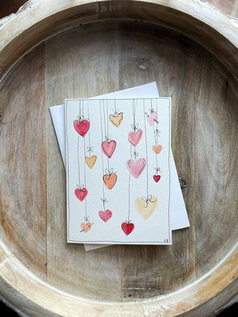 "This hand painted watercolor card makes the perfect sweet something for your significant other this Valentine's Day, anniversary, or even just a random day you're thinking about them! You will receive the hand painted watercolor card with a matching envelope. The card measures at 5\" x 7\" (size A7) and the folded card is blank on the inside for you to write a sweet message. *If you would like me to write your message inside the card and send it to the recipient I would be more than happy to accommodate this request. Please write your message in the NOTE TO SELLER box before you checkout. Please also include the recipients name and address in the order details.* Standard painting time for cards are 2-3 business days which is not included in the shipping time. Cards are shipped via USPS an Handwritten Cards For Boyfriend, Watercolor Birthday Card For Friend, Name Day Card Ideas, Anniversary Card Ideas For Him Diy, Painted Anniversary Card, Mothers Day Cards Watercolor Simple, Mother’s Day Cards Handmade Watercolor, Happy Mother's Day Card Homemade, Simple Paintings For Boyfriend