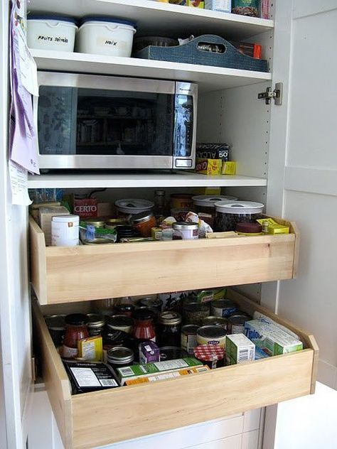 If you have so much food in your kitchen that you have to pack cans all the way to the back, you need to enlist the help of rolling drawers so you can actually find what you need when you're whipping up dinner. Click through for more on this and other IKEA hacks to organize your whole home. Pull Out Pantry Shelves, Hackers Ikea, Diy Pantry Shelves, Armoire Ikea, Ikea Hack Kitchen, Hacks Ikea, Ikea Design, Diy Pantry, Ikea Hackers