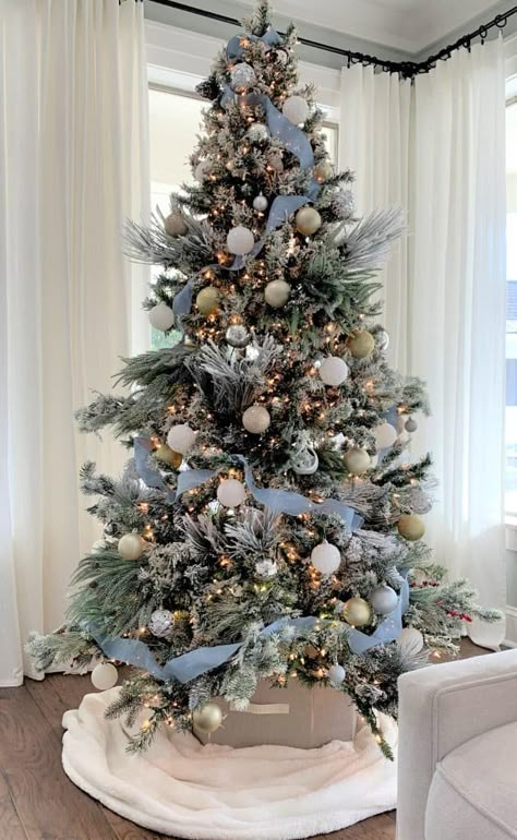 Farmhouse Blue Christmas Tree, Christmas Tree Themes Colors Blue And Silver, Sky Blue And Silver Christmas Tree, White Silver Blue Christmas Tree, Blue And White Farmhouse Christmas Tree, Blue Christmas Inspiration, Silver And Light Blue Christmas Tree, White Gold And Blue Christmas Tree, Blue House Christmas Decor Exterior