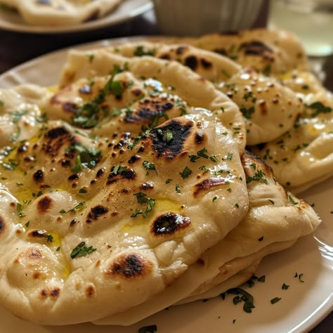 🍞🔥 Master the art of Homemade Naan Bread! Soft, fluffy, and perfect for scooping up your favorite dishes. #NaanBread #HomeBaking Homemade Naan Bread Recipe This easy-to-make naan bread is wonderfully soft and chewy, ideal for pairing with curries, dips, or enjoying as is. Ingredients: All-purpose flour: 500g Instant yeast: 7g Sugar: 10g Salt: 5g Warm water: 240ml Milk: 120ml Egg: 1 (beaten) Butter (melted): 60g Optional: Garlic powder or minced garlic, chopped cilantro for garnish Directi... Naan Bread Aesthetic, Butter Garlic Naan, Naan Aesthetic, Thai Bread, Naan And Curry, Make Naan Bread, Naan Bread Recipe, Homemade Naan, Homemade Naan Bread